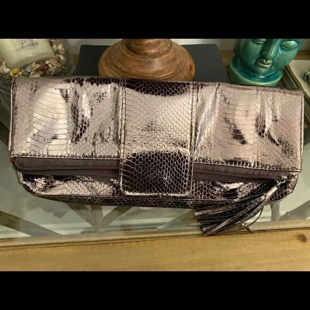 Metallic embossed envelope clutch w pink interior. Beautiful night out bag.
